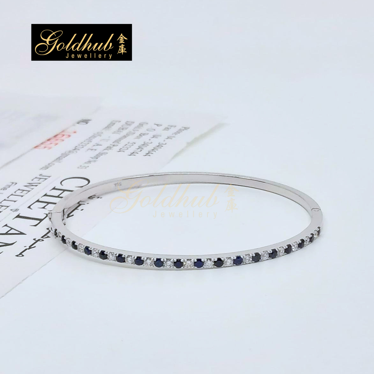 Blue Sapphire and Diamonds Bangle in White Gold