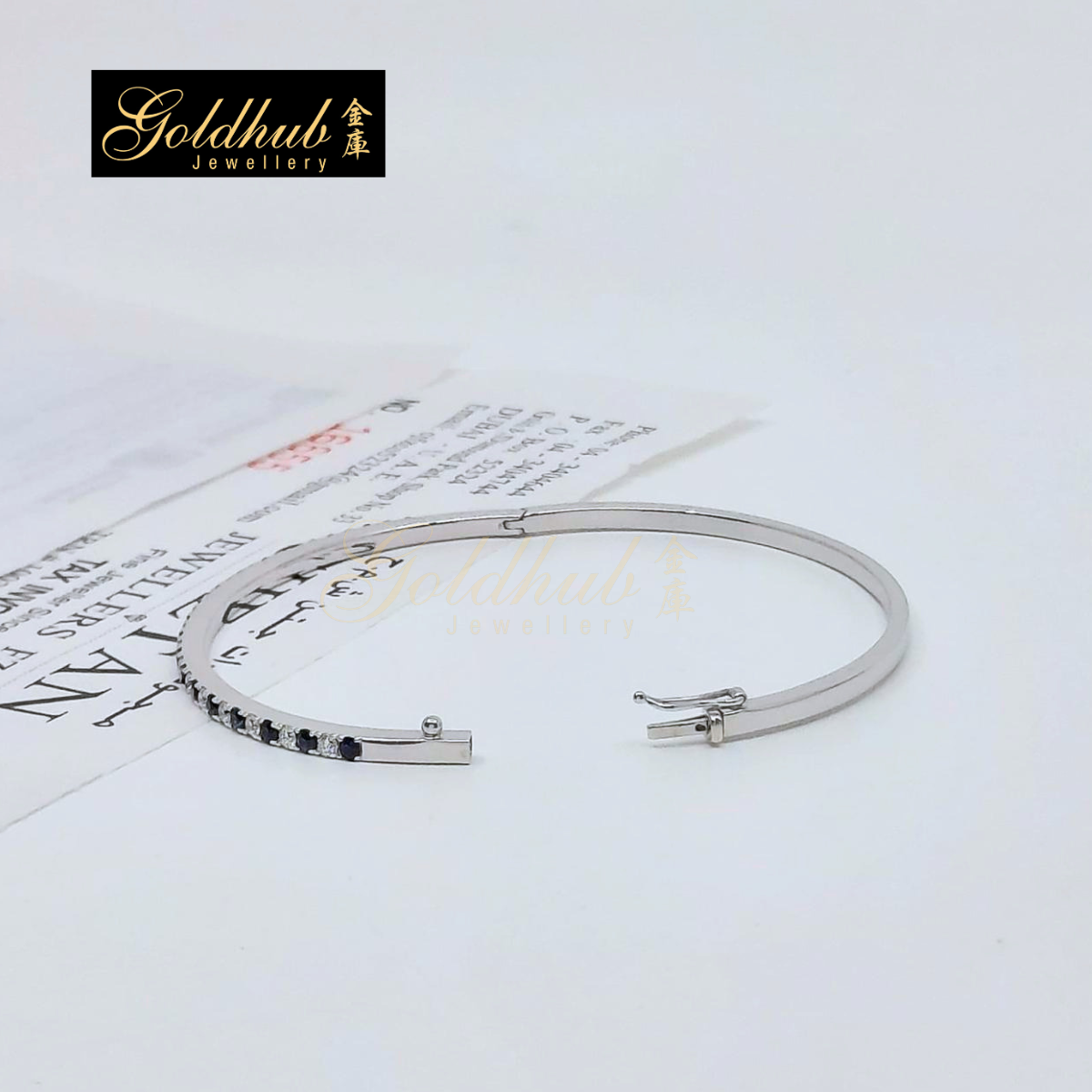 Blue Sapphire and Diamonds Bangle in White Gold